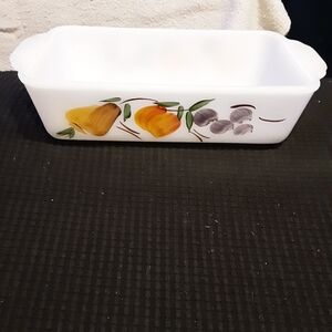 This vintage Fire King loaf pan is made of hand-painted milk glass